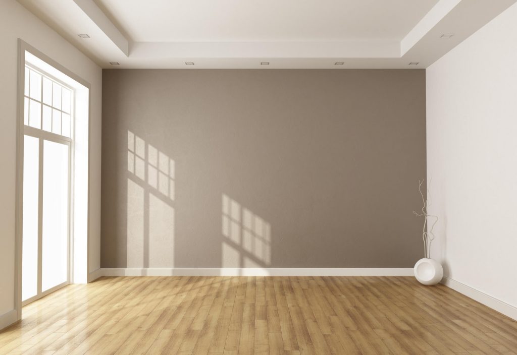 Room with skirting board heating installed around the walls