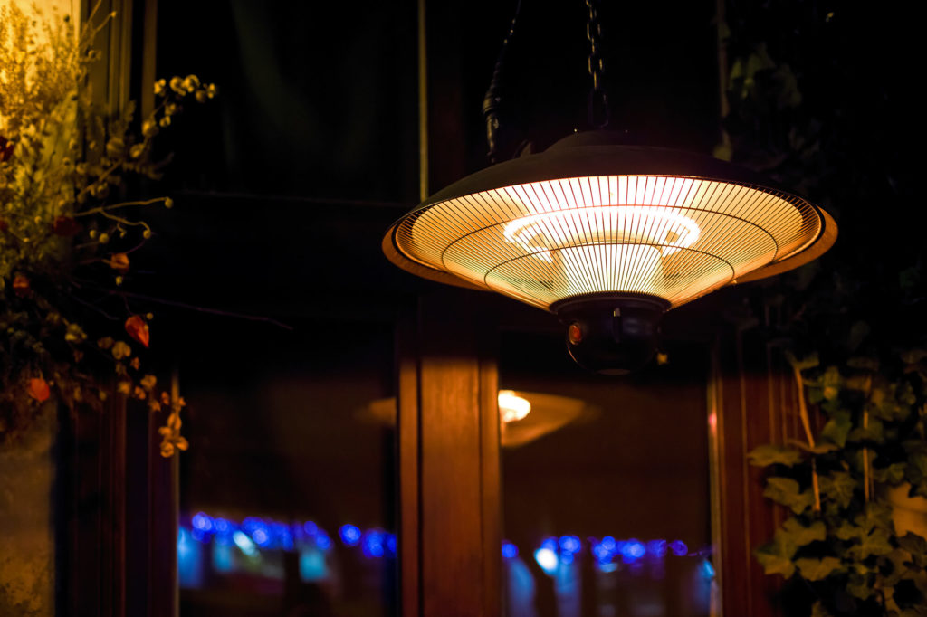 Hanging electric patio heater checked before use