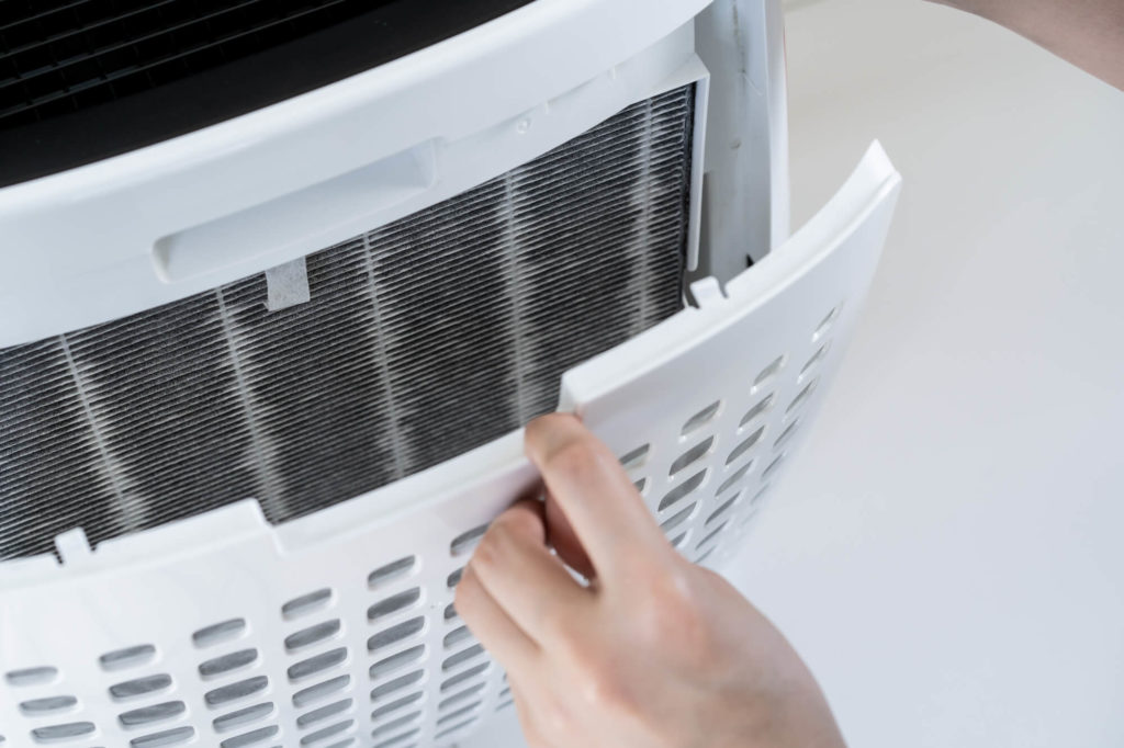 Dirty portable air conditioner filter that needs cleaning