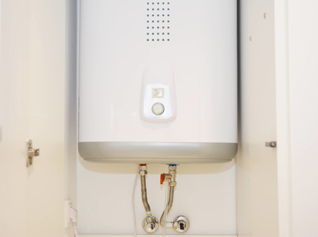 Combi boiler protected by treated central heating system water