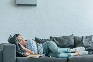 Woman sleeping on sofa